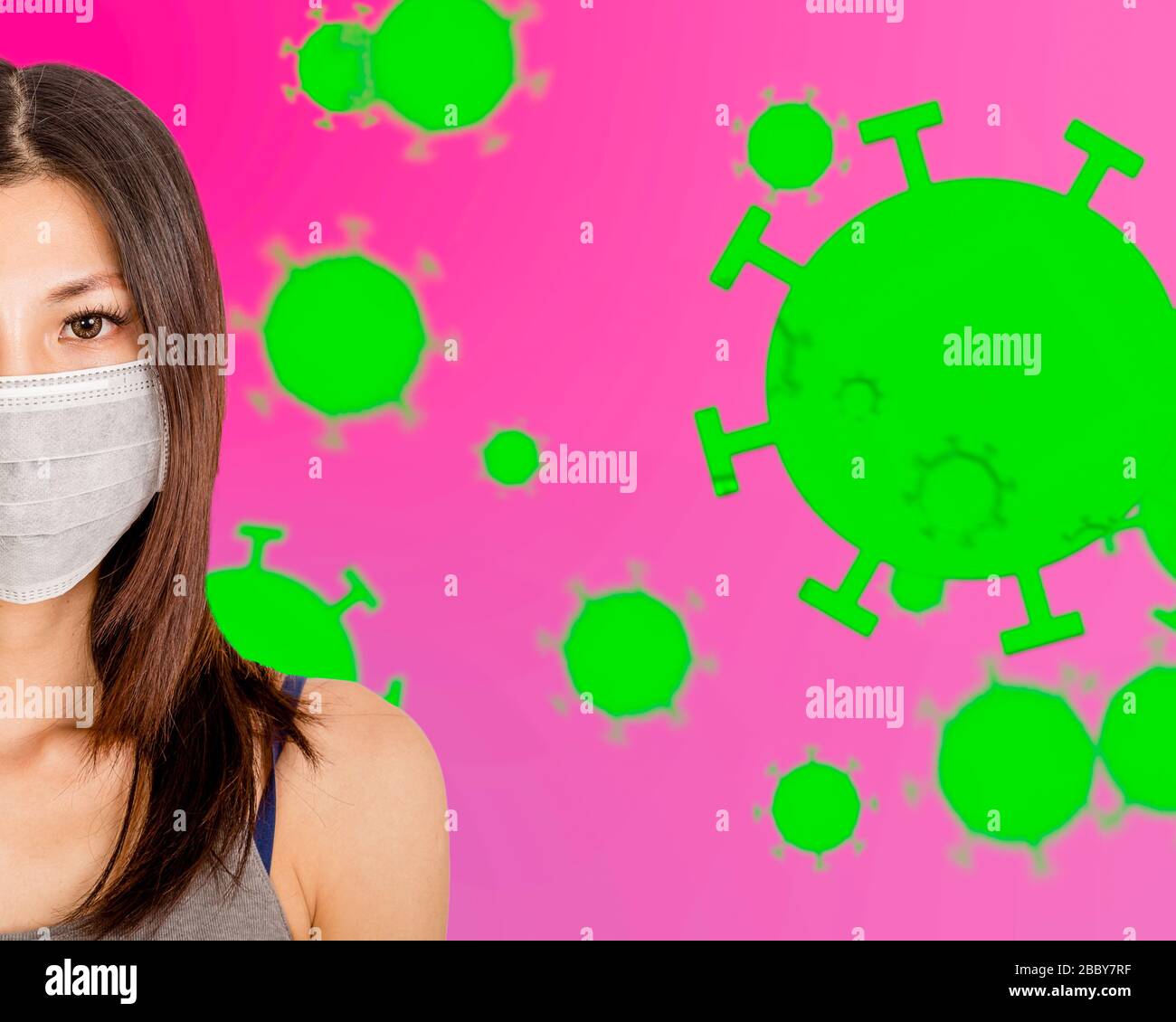 Half face of Asian American woman wearing surgical mask with coronavirus cells in background Stock Photo