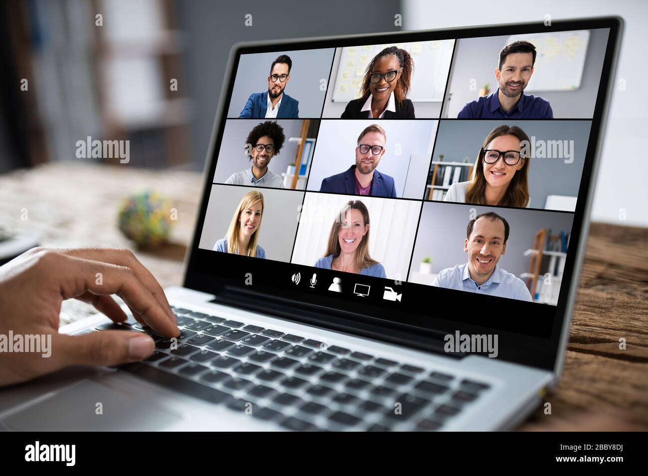 Man Working From Home Having Online Group Videoconference On Laptop Stock Photo