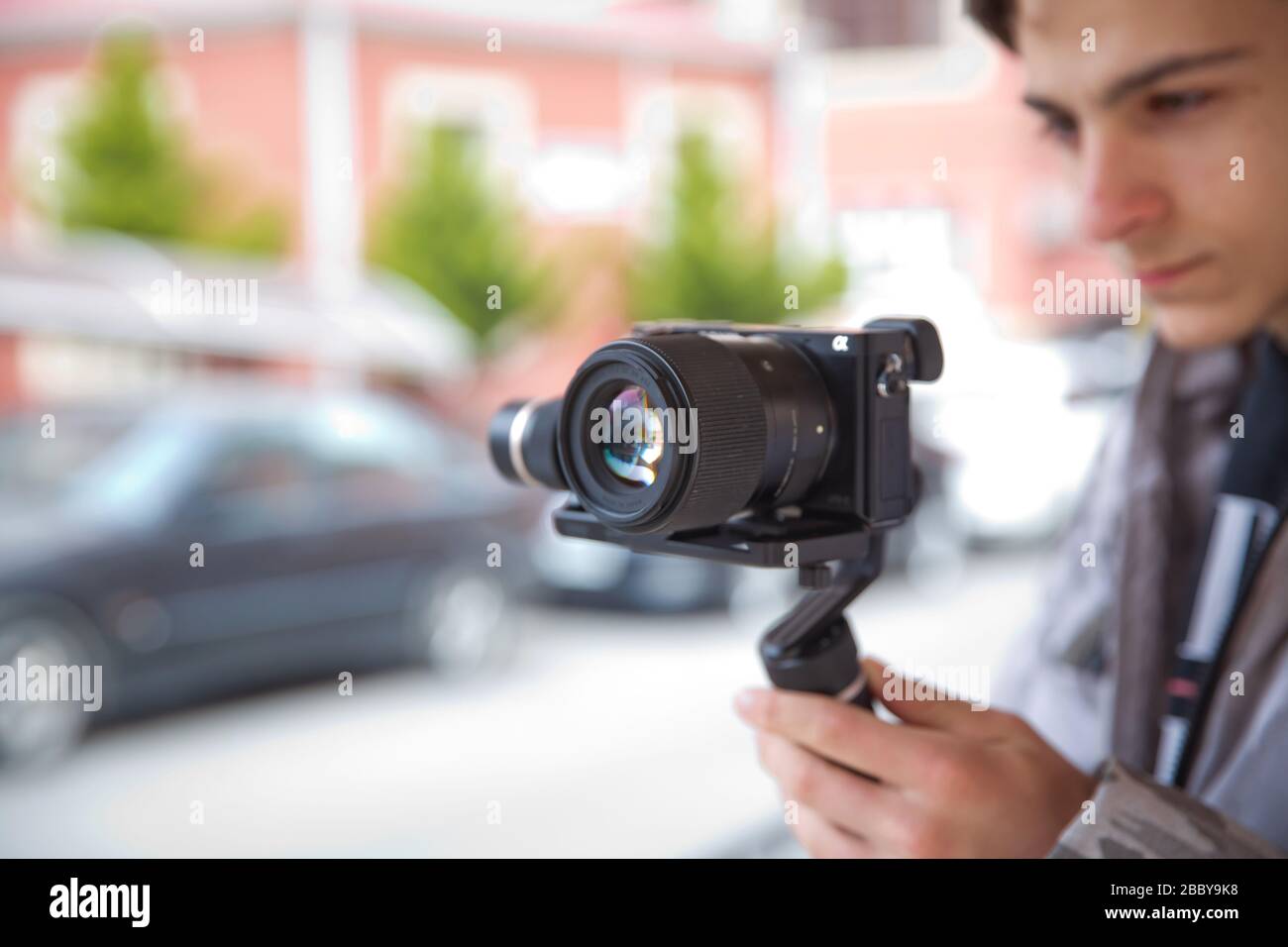 Focus on tripod mounted camera screen showing . Digital equipment recording video . Close up