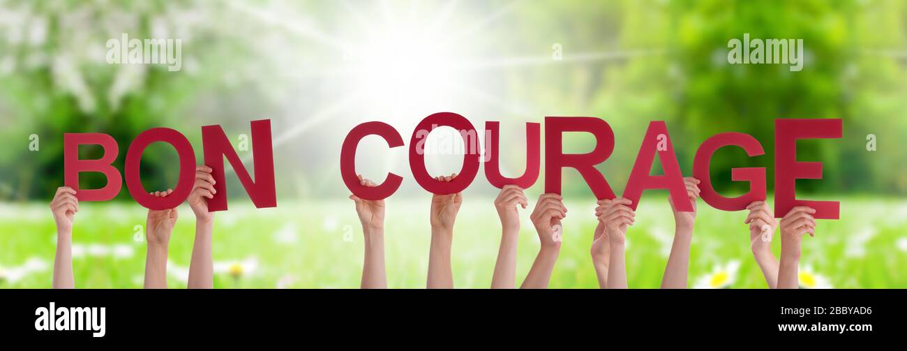 People Hands Holding Word Bon Courage Means You Can Do It, Grass Meadow Stock Photo Alamy