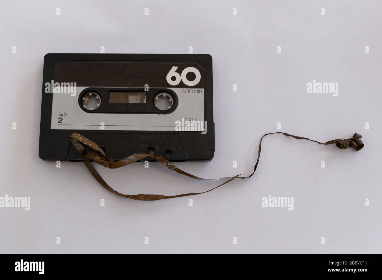A cassette tape has its tape broken Stock Photo