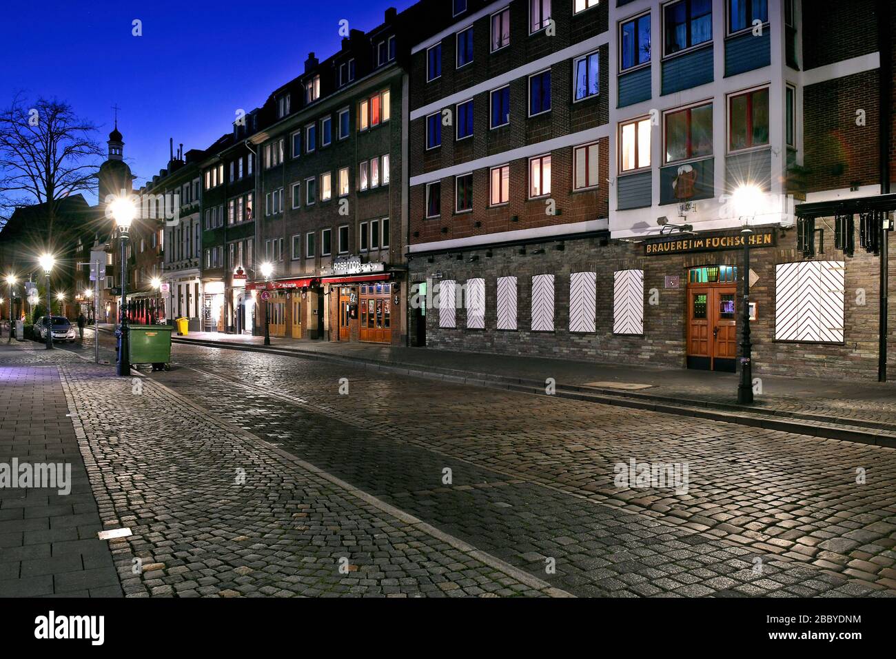 Empty streets in the evening in Düsseldorf during the Corona crisis, Brauerei Füchschen, Ratinger Strasse. Stock Photo