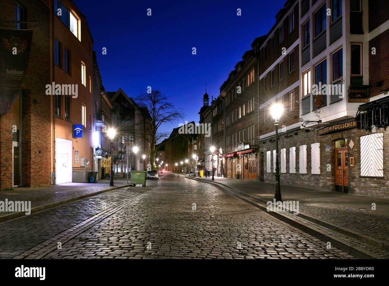 Empty streets in the evening in Düsseldorf during the Corona crisis, Brauerei Füchschen, Ratinger Strasse. Stock Photo