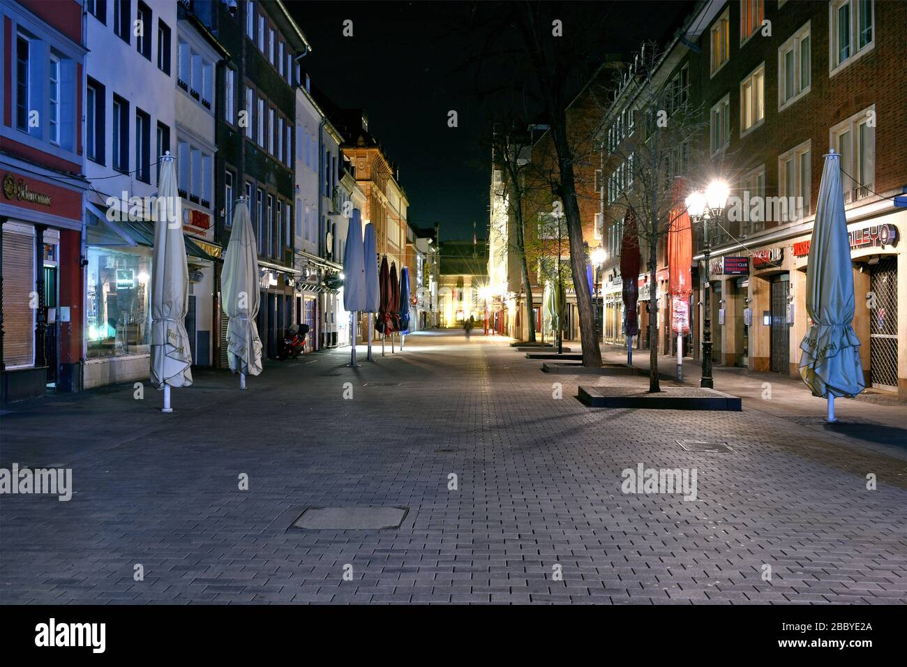 Empty streets in the evening in Dusseldorf during the Corona crisis, Bolkerstrasse, Old Town. Stock Photo