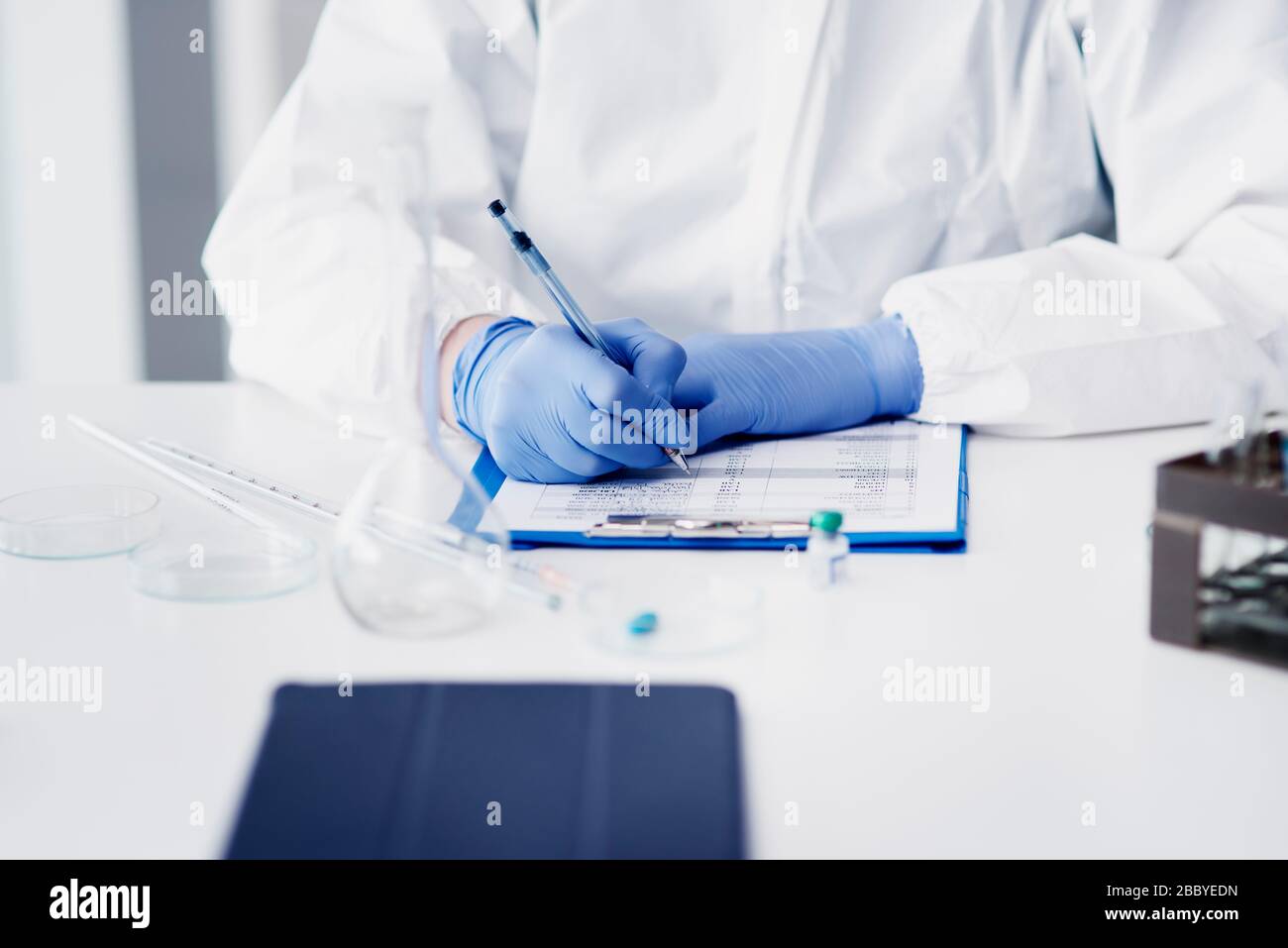 Science technician making a medical exam Stock Photo