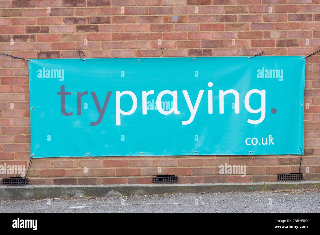 Try praying banner outside a church during COVID-19 Coronavirus outbreak lockdown period. Turn to God. Trypraying is for those who are not religious Stock Photo