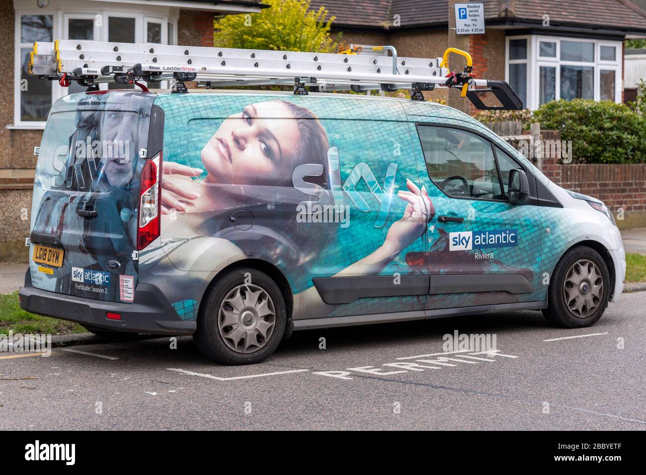 Sky Atlantic satellite television installation van with graphic wrap, with images from Riviera and Fortitude, season 2. During COVID-19 lockdown Stock Photo