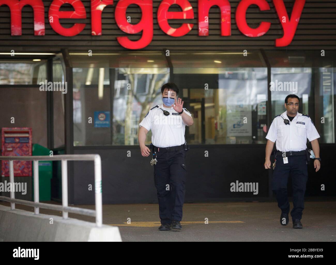 Vancouver, Canada. 1st Apr, 2020. Security guards walk outside the