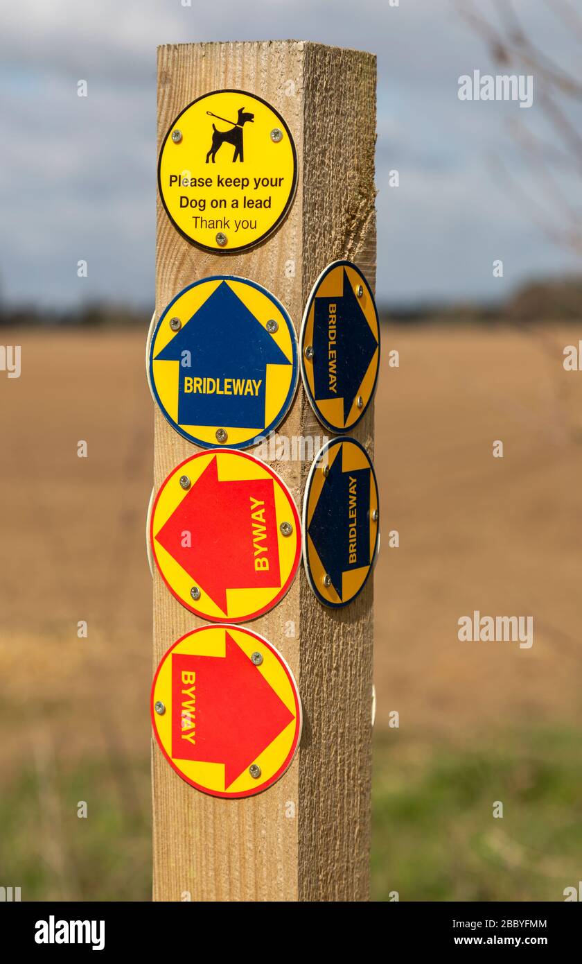 Close up of wooden post with byway and bridleway direction pointer ...