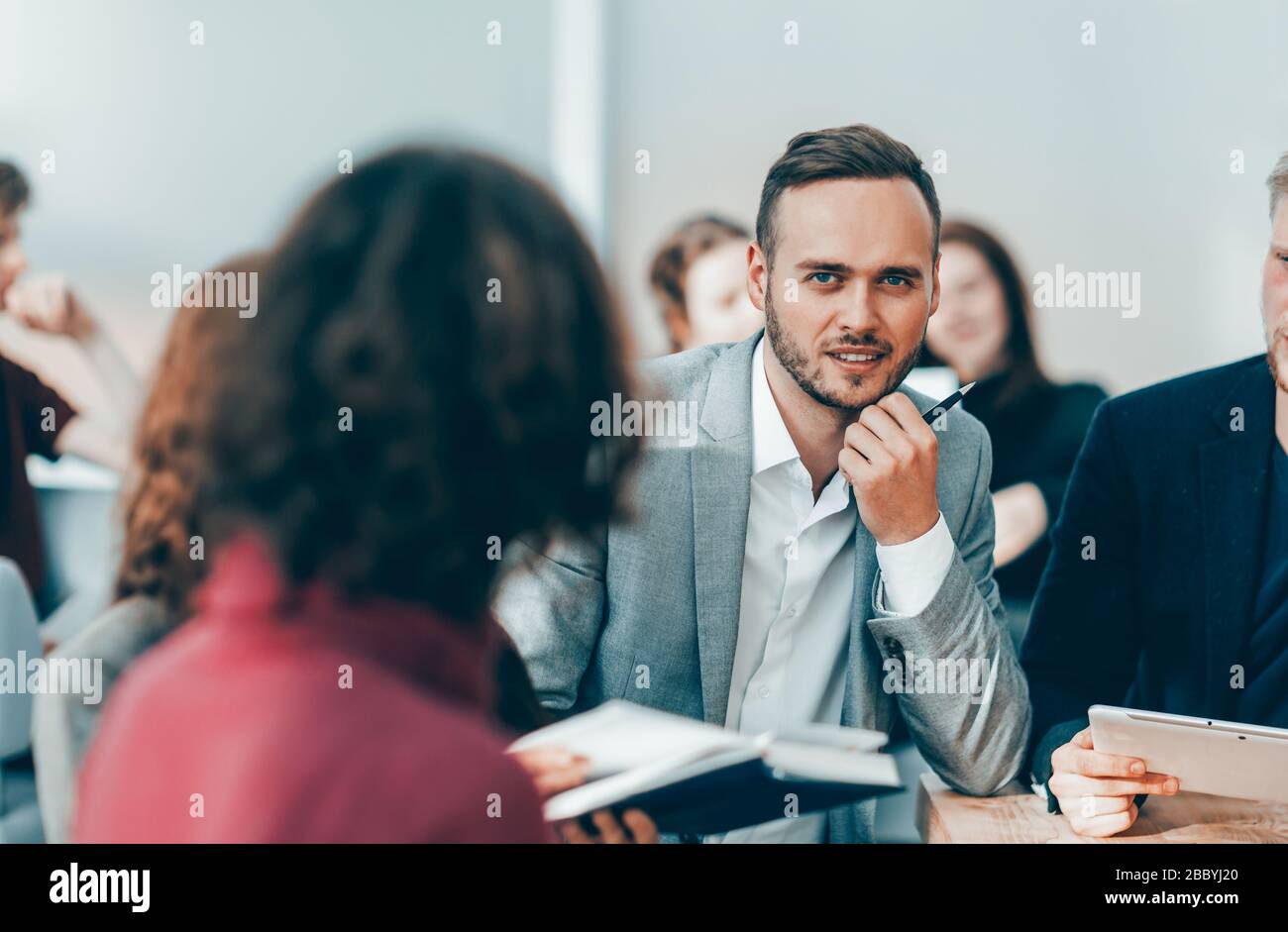 close up. brooding entrepreneur sitting at office Desk Stock Photo