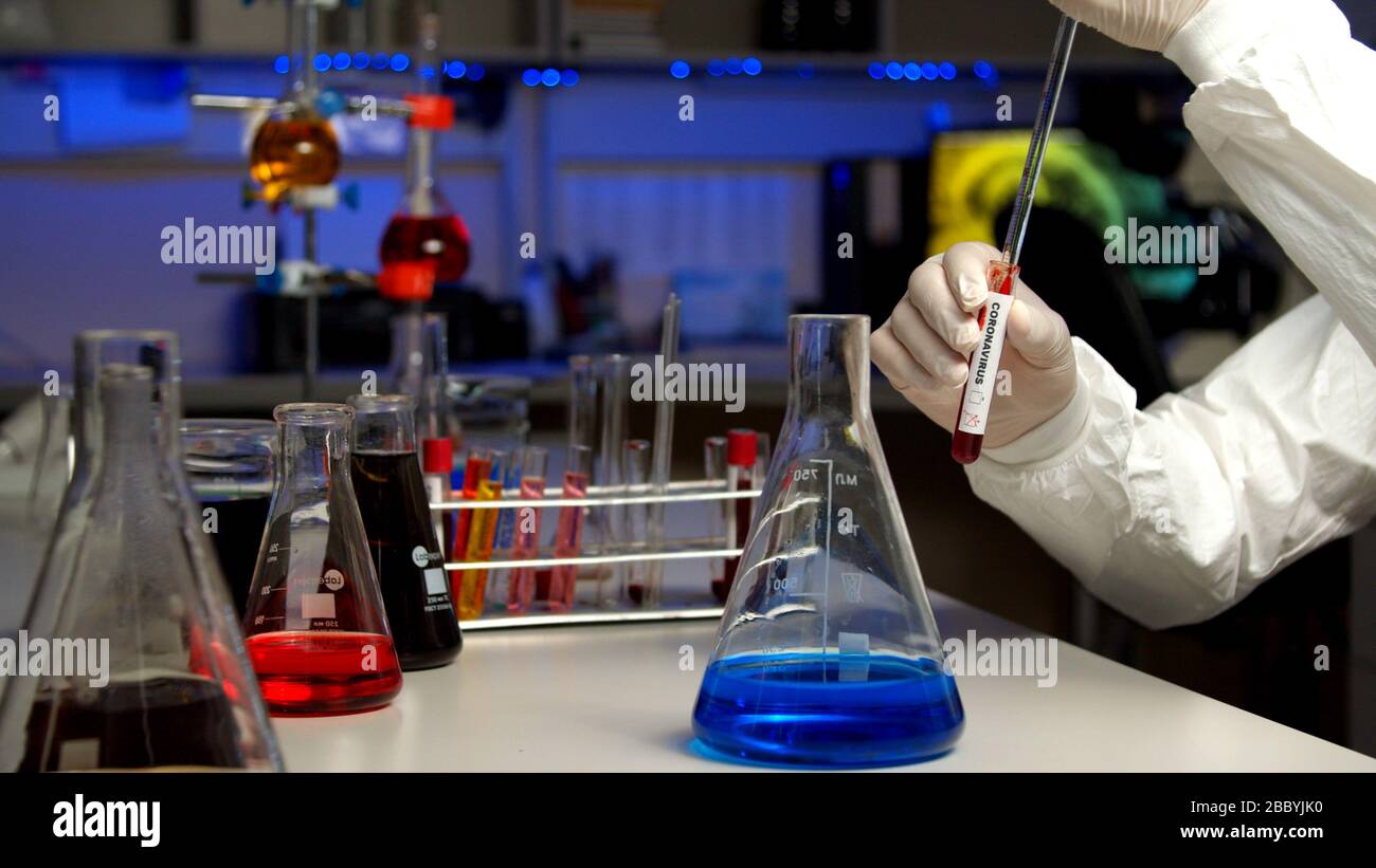 Scientist testing sample for COVID-19 in the laboratory Stock Photo - Alamy