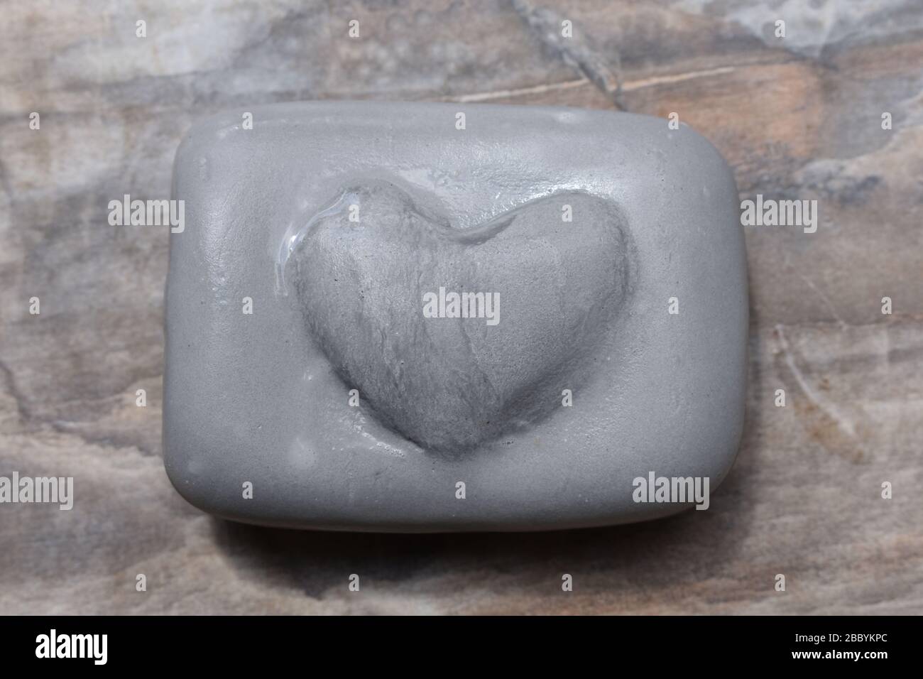 Grey soap with heart Stock Photo