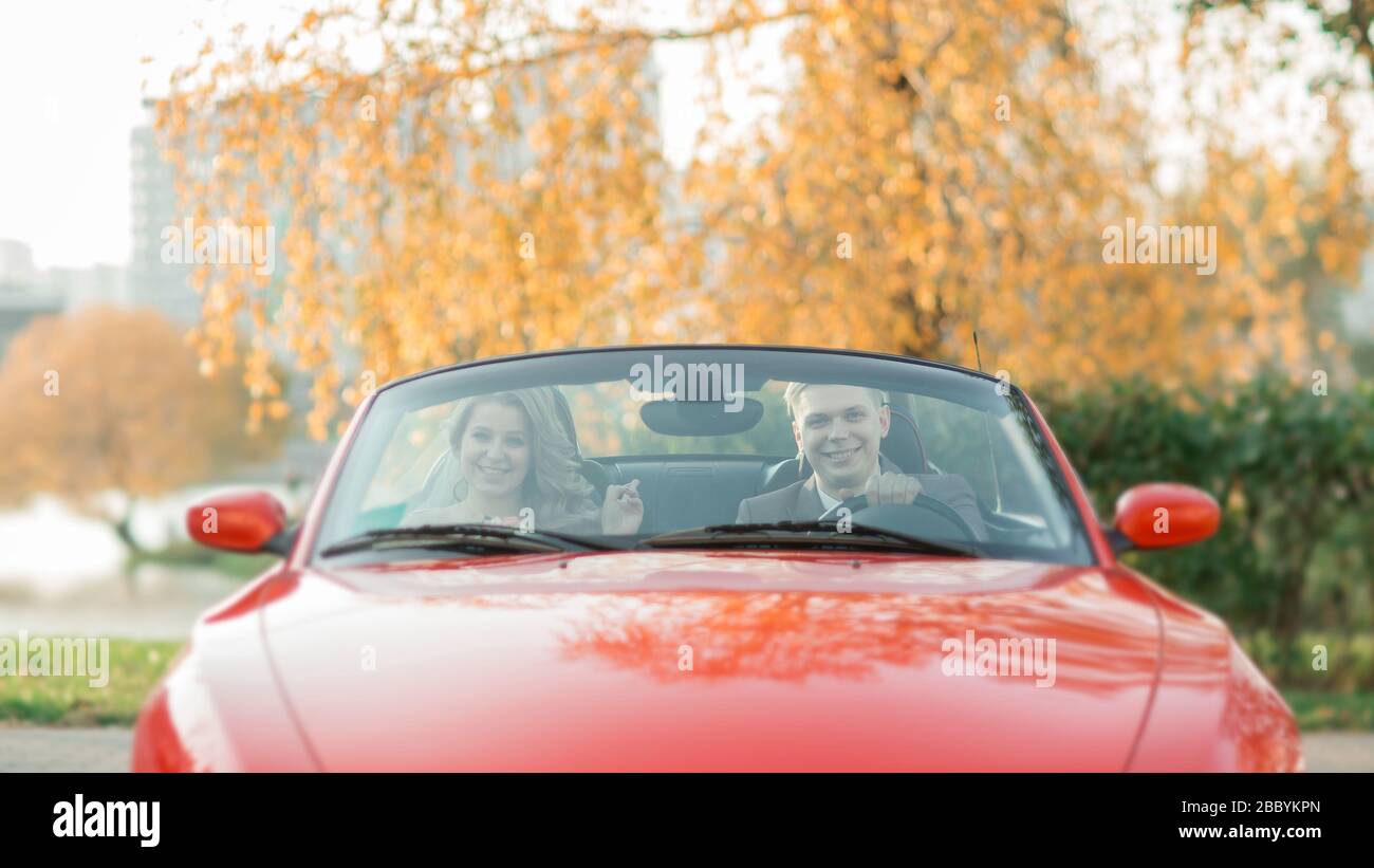 happy bride and groom sitting in a luxury car Stock Photo - Alamy