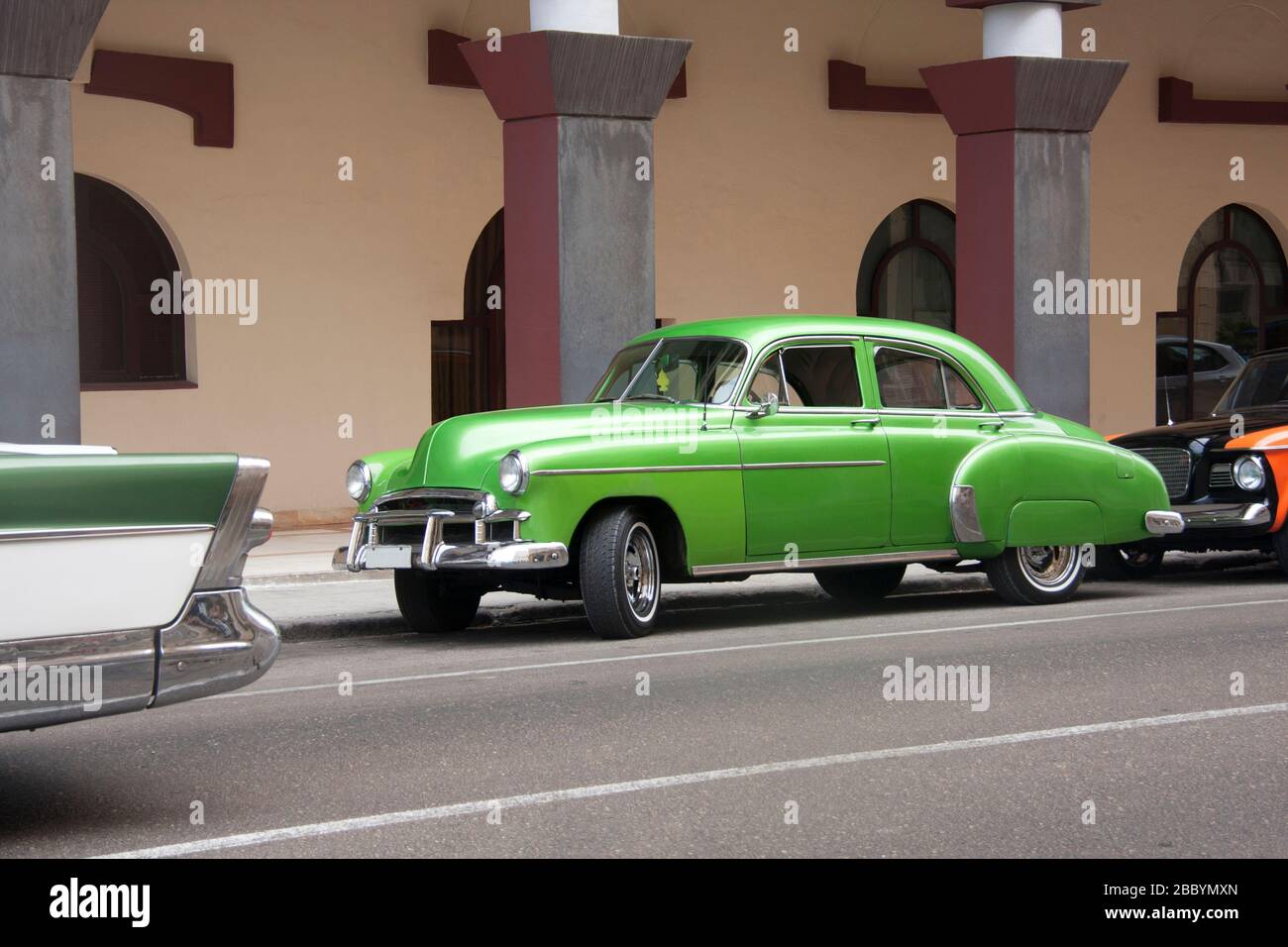 HAVANA, CUBA - APRIL 01, 2017: American classic car from the 50s in green color parked in central street of the city of Havana, Cuba Stock Photo