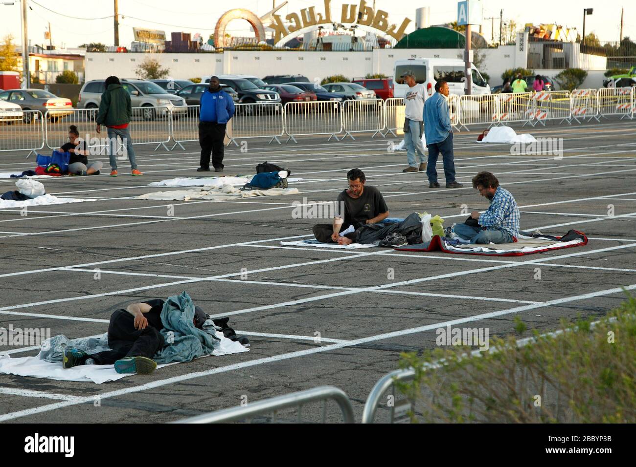 Las Vegas, United States. 01st Apr, 2020. Homeless individuals practice self-distancing measures at a temporary open air shelter at the Cashman Center parking lot during the Coronavirus closure of Hotels and Casino's in Las Vegas, Nevada on Wednesday, April 1, 2020. Photo by James Atoa/UPI Credit: UPI/Alamy Live News Stock Photo