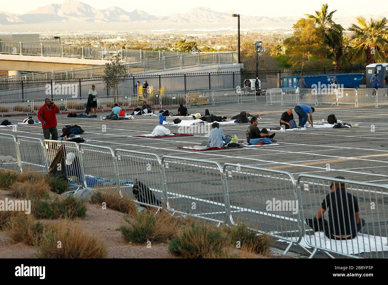 Las Vegas, United States. 01st Apr, 2020. A view of homeless individuals practicing self-distancing measures at a temporary shelter at the Cashman Center parking lot during the Coronavirus closure in Las Vegas, Nevada on Wednesday, April 1, 2020. Photo by James Atoa/UPI Credit: UPI/Alamy Live News Stock Photo