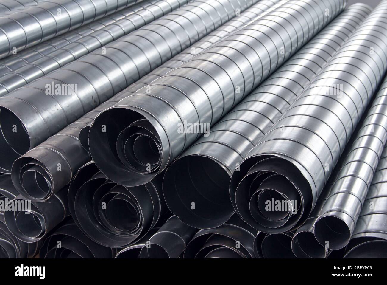 Steel pipes for ventilation system. Ventilation ducts components Construction equipment. Stock Photo