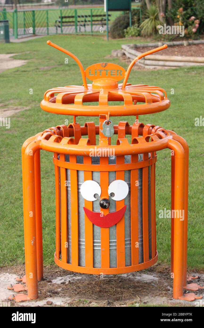 Orange litter bin with funny face. Clayhall Park, Longwood Gardens