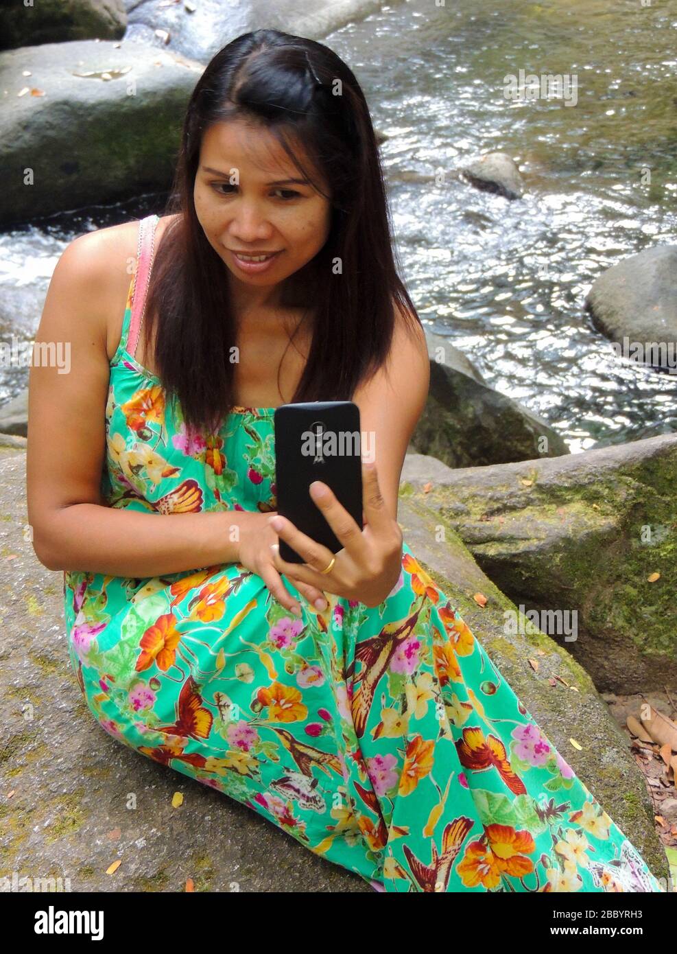 The narcissist Girl taking a selfie with a phone I wonder who she is