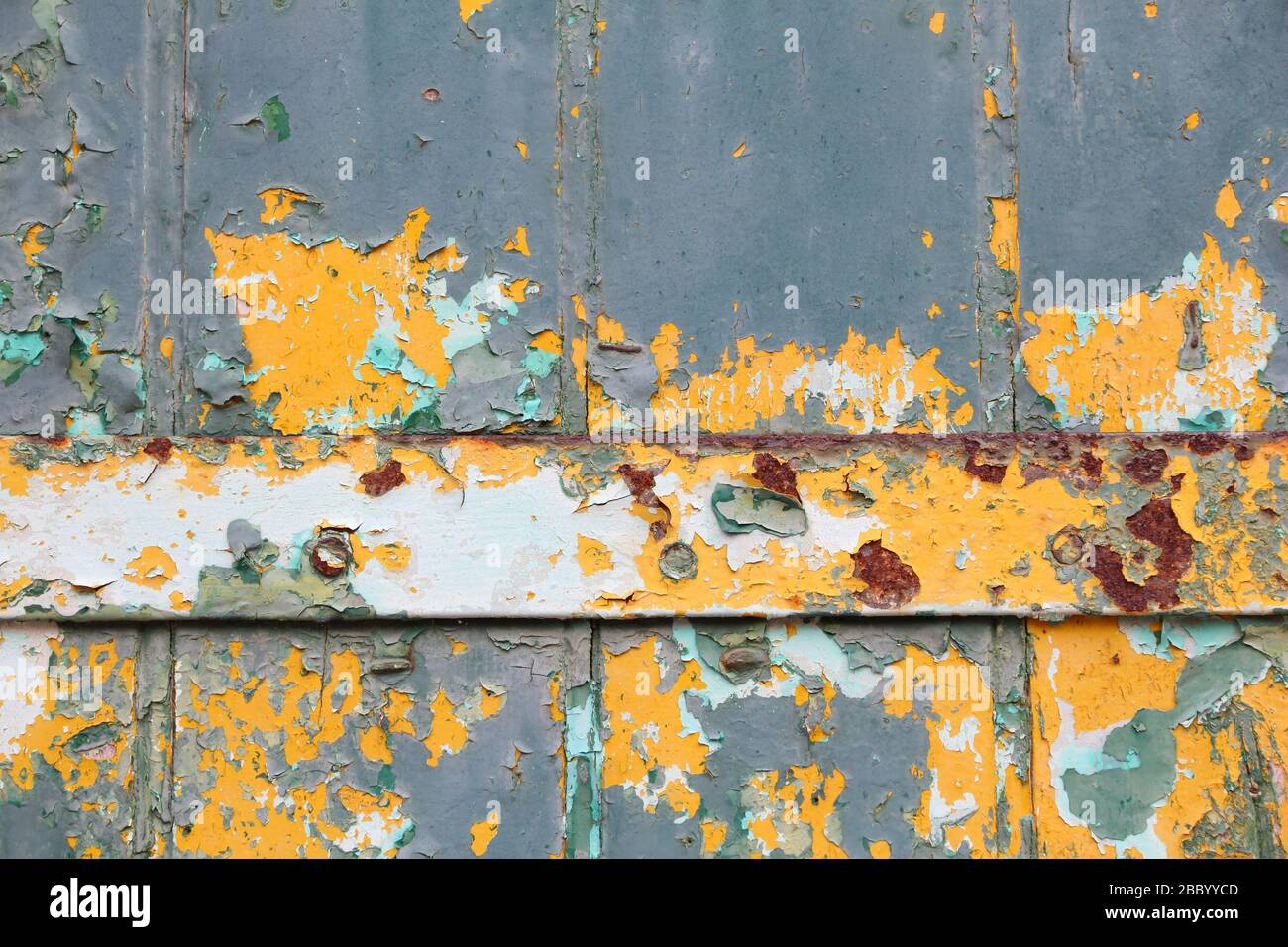 Texture photo. Peeling paint vintage texture. Grunge style old wooden door background. Stock Photo