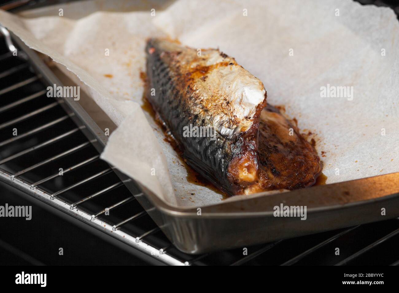 Baked Mackerel. In the oven on a baking sheet Stock Photo Alamy