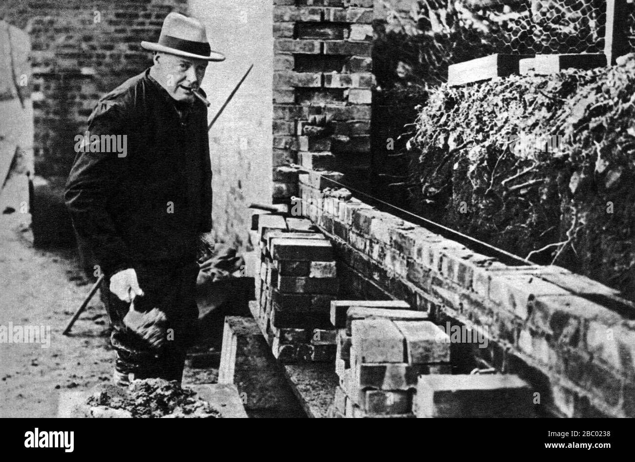 Winston Churchill building a wall at Chartwell. August 1928. Stock Photo