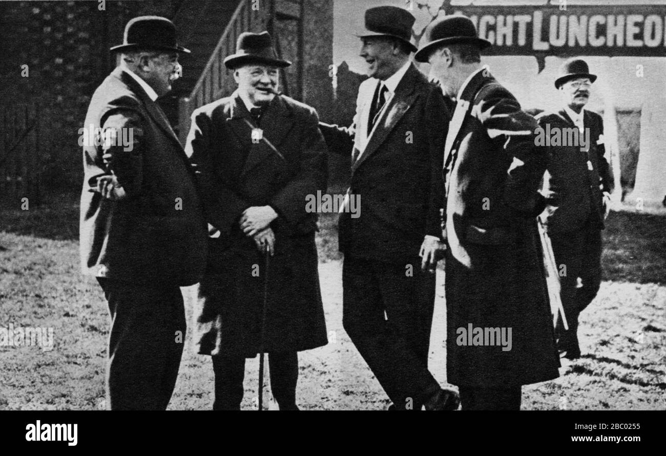 Winston Churchill at Aintree racecourse, Liverpool, with the Earl of Derby and the Duke of Westminster. July 1929 Stock Photo
