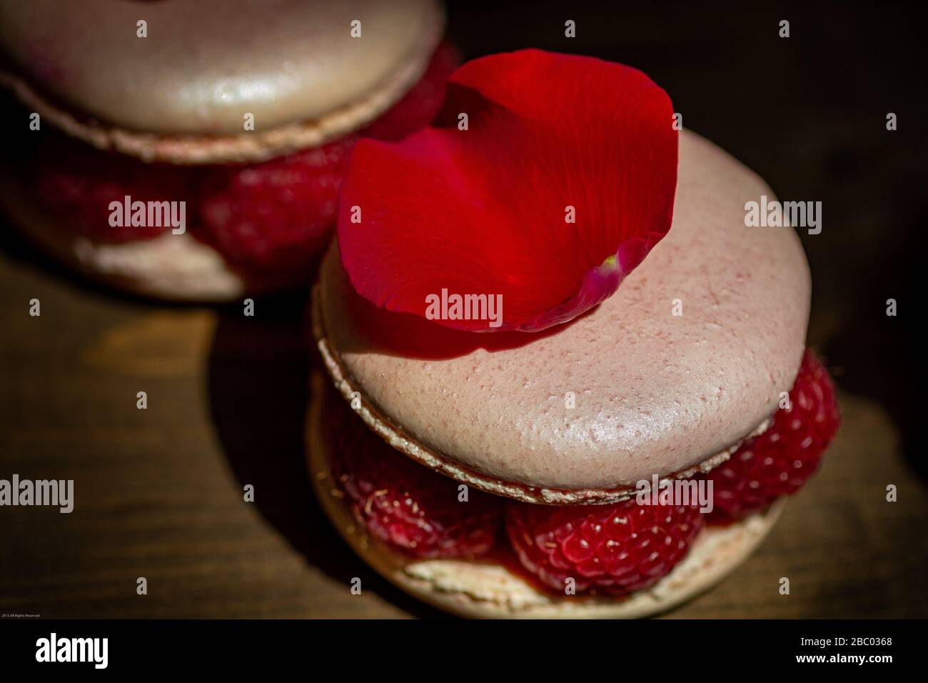 Macarons with Raspberries Stock Photo
