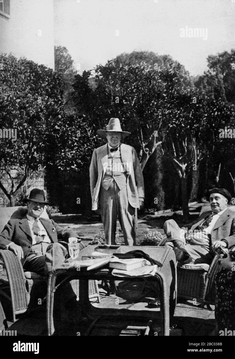 Winston Churchill, Somerset Maugham and H.G.Wells at Villa Mauresque. Maugham's home on Cap Ferrat, Cotes D 'Azure, Riviera. France. April 1937. Stock Photo