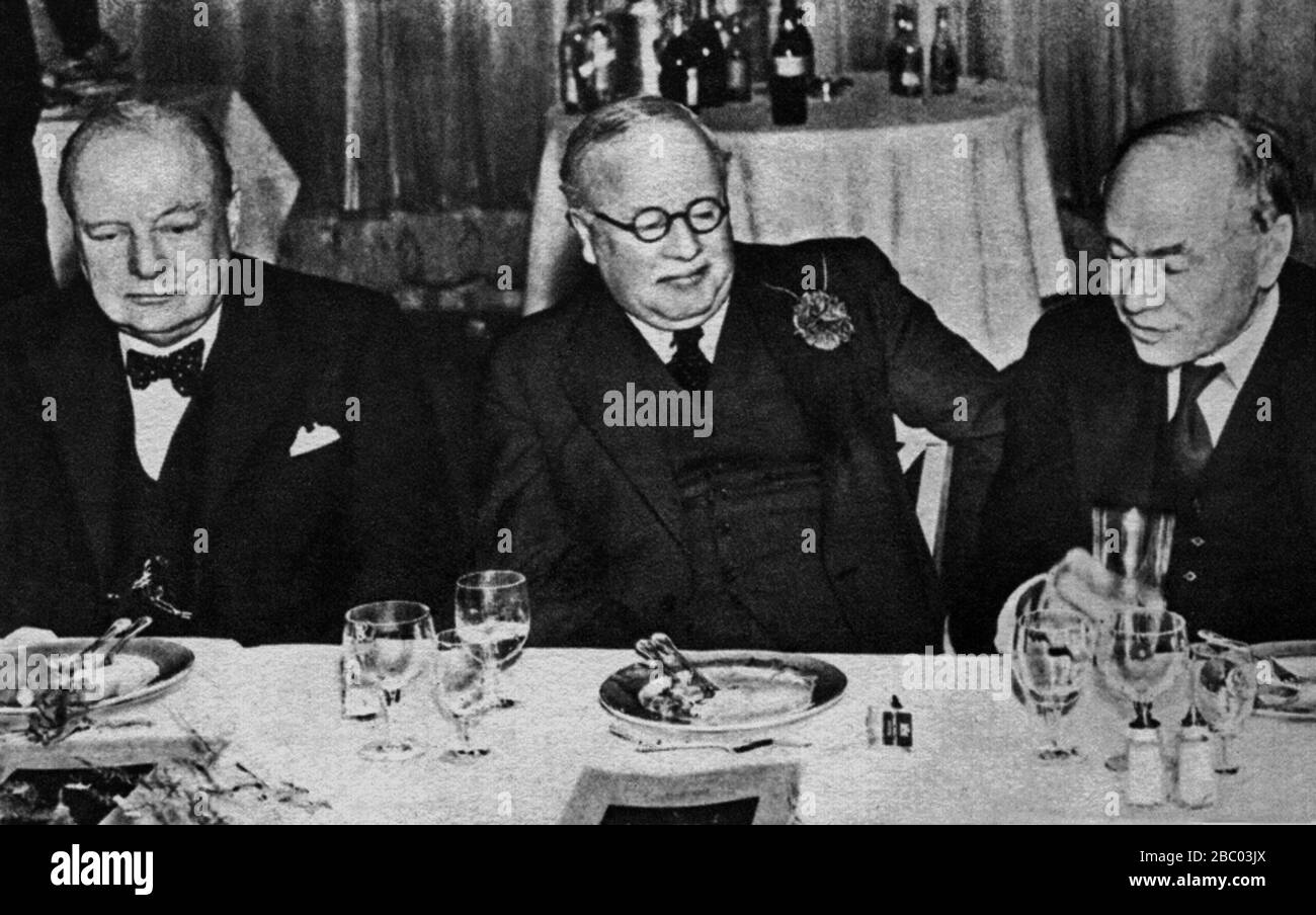 Churchill with Lord Beaverbrook and Chancellor of the Exchequer Kingsley Wood at a News of the World luncheon at the Dorchester Hotel.1st May 1941. Stock Photo