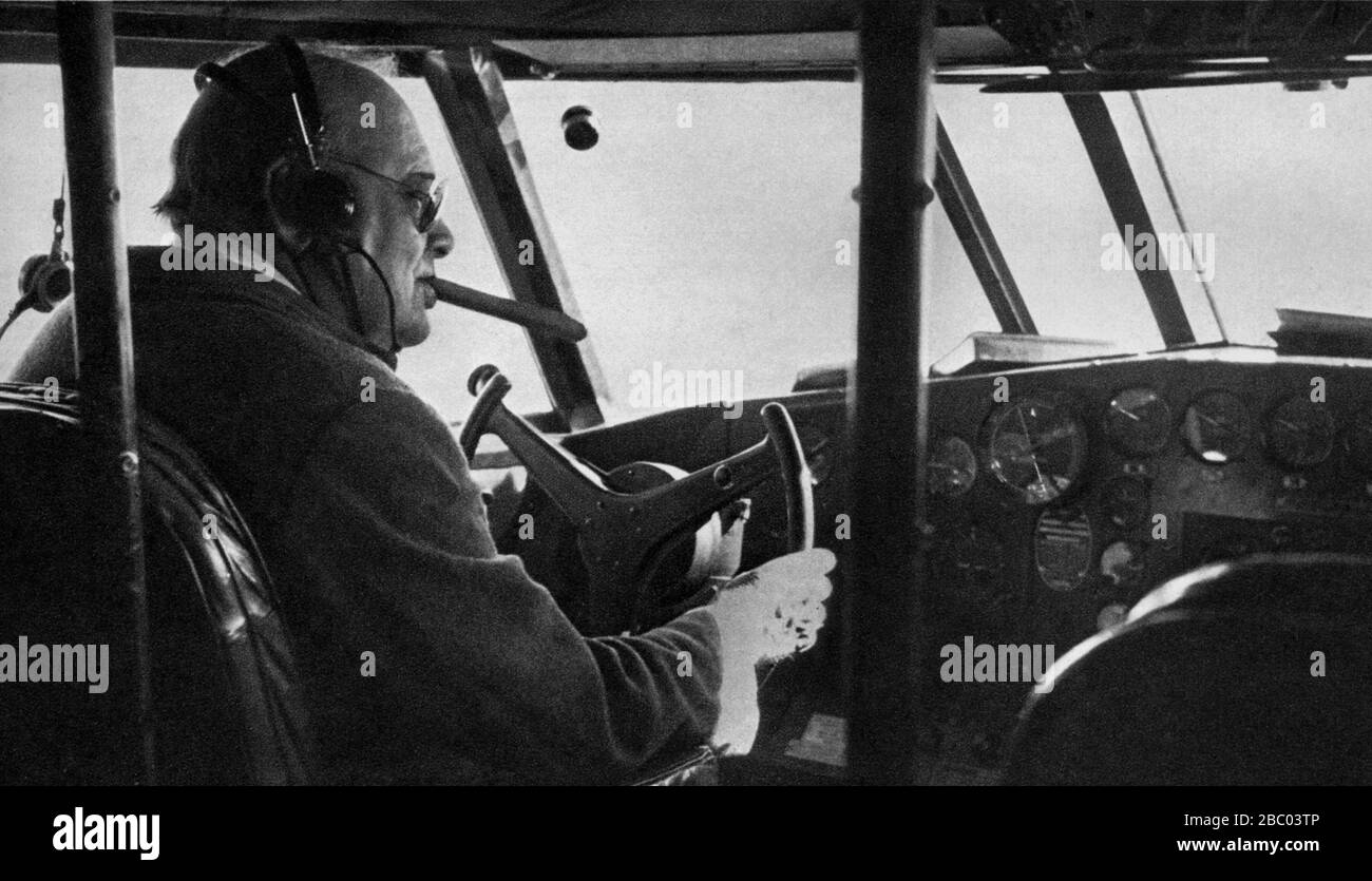 Winston Churchill at the controls of the flying boat, captained by Commander Kelly Rogers, taking him from Bermuda to Britain. 14th January 1942. Stock Photo
