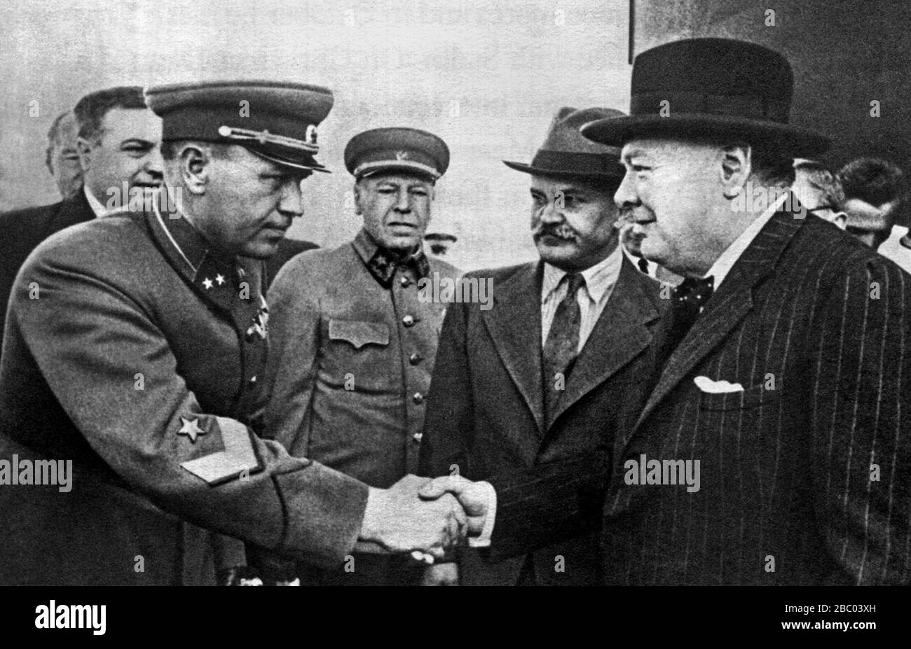 Winston Churchill at Moscow airport shaking hands with the Commandant of Moscow. Also present Molotov and Marshall Shaposhnikov. 17th August 1942 Stock Photo