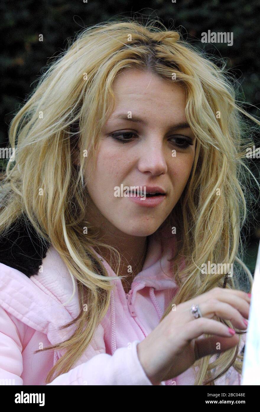 25 October 2005. Britney Spears surfaces outside the rear exit of her  London Mandarin Oriental Hotel in Hyde Park early this morning at around  8am, after a night out at Rex Cinema