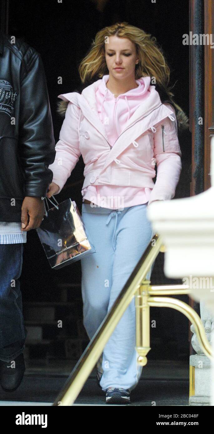 25 October 2005. Britney Spears surfaces outside the rear exit of her London Mandarin Oriental Hotel in Hyde Park early this morning at around 8am, after a night out  at Rex Cinema and Bar in London's Soho, reportedly drinking Vodka and tonic and Champagne into the early hours. It looks like Britney has missed her alarm call and forgot to brush her hair! She is certainly going to need that extra hour in bed tonight as the clocks go back! Picture by Tony Henshaw Stock Photo