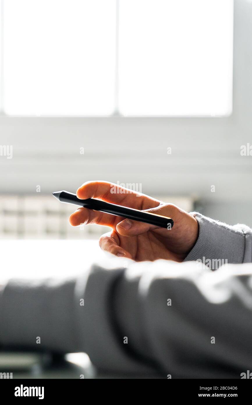 Hand holding a digital pen Stock Photo - Alamy