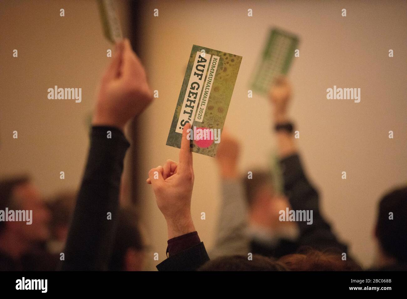 The Greens are drawing up their district council candidate list for the 2020 local elections in the Gernlinden citizens' centre. In the picture you can see the counting of the voter's entitlement to vote by a show of hands. [automated translation] Stock Photo