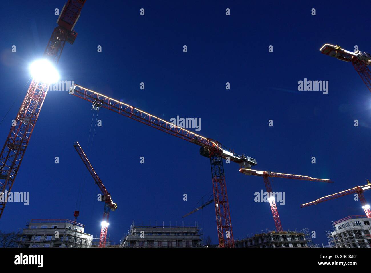 Cranes with construction site lighting on the site of the former Osram headquarters on Schönstraße in Giesing. A quarter with 370 apartments is being built here. [automated translation] Stock Photo