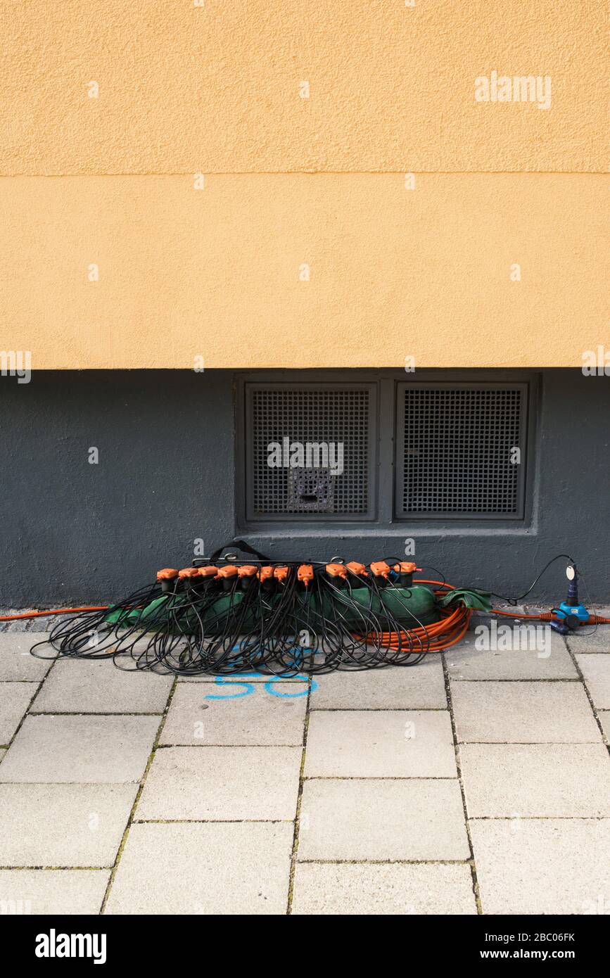 In Munich, orange cables are laid for seismic measurements for geothermal energy. [automated translation] Stock Photo