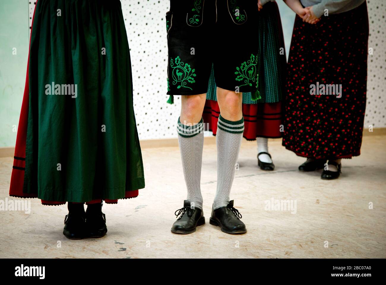Members of Bavaria's youngest costume club, D'Moasawinkler from Mammendorf, practice folk dancing and Schuhplatteln. [automated translation] Stock Photo