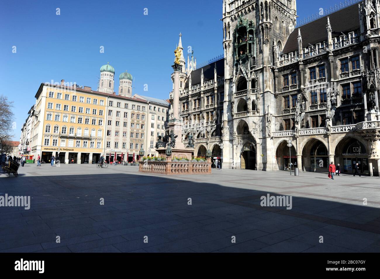 Due to the restrictions in public life in the face of the Corona pandemic, Munich's inner city is almost deserted. The picture shows the Marienplatz and the city hall. [automated translation] Stock Photo