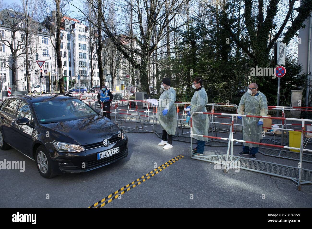 Start of the drive-in/walk-through test station for suspected corona in people in system-critical professions, operated by the Tropical Institute at the LMU Clinic in Georgenstraße. The picture shows a female driver in her car being tested by means of a nasal swab. [automated translation] Stock Photo