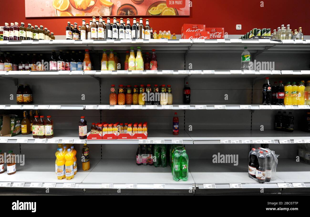 Food shopping in times of the Corona pandemic: in the picture empty shelves with toilet paper, pasta and drinks in a branch of the supermarket chain Rewe in Obergiesing. [automated translation] Stock Photo