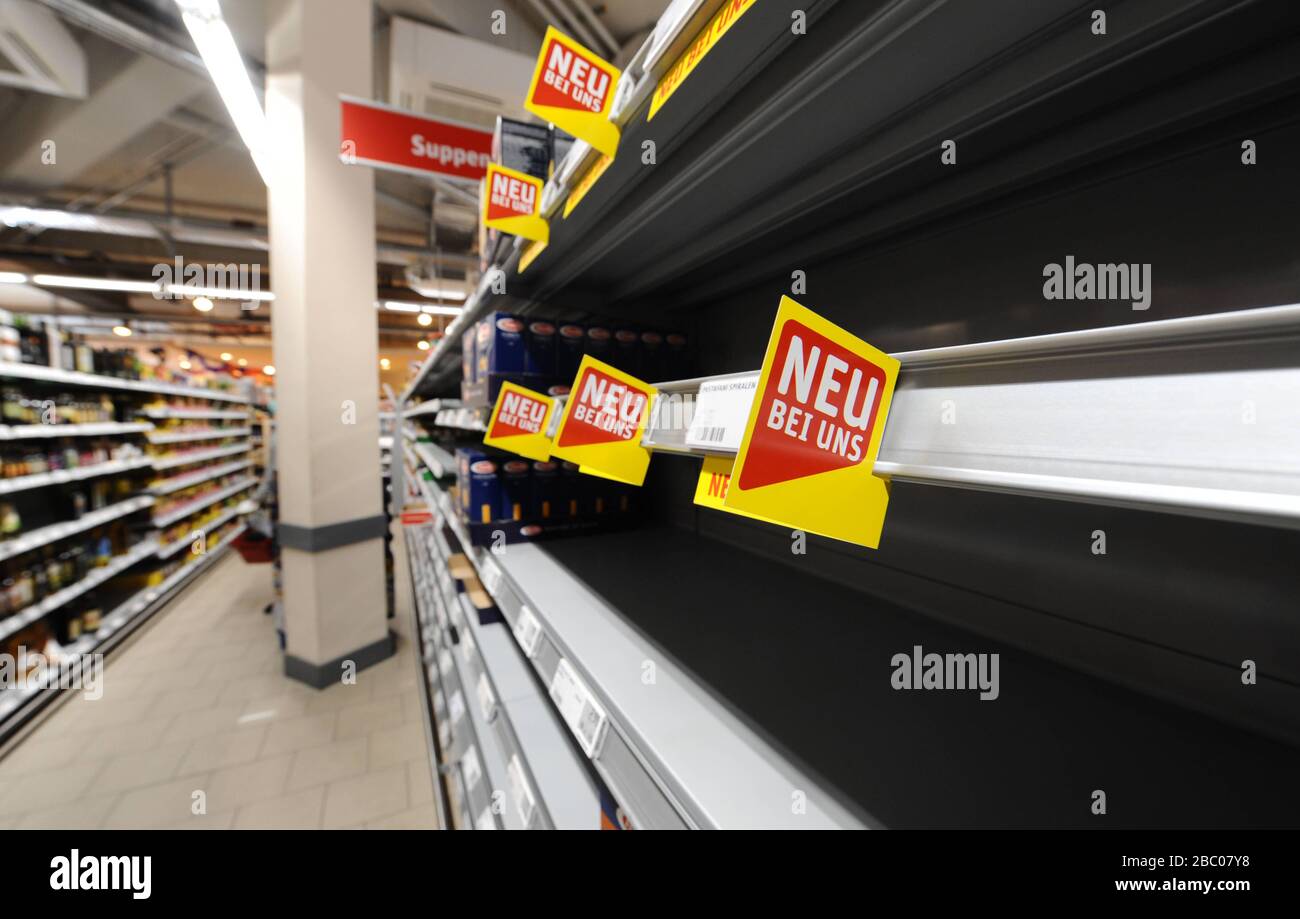 Food shopping in times of the Corona pandemic: in the picture empty shelves of toilet paper and pasta in a branch of the supermarket chain Rewe in Obergiesing. [automated translation] Stock Photo