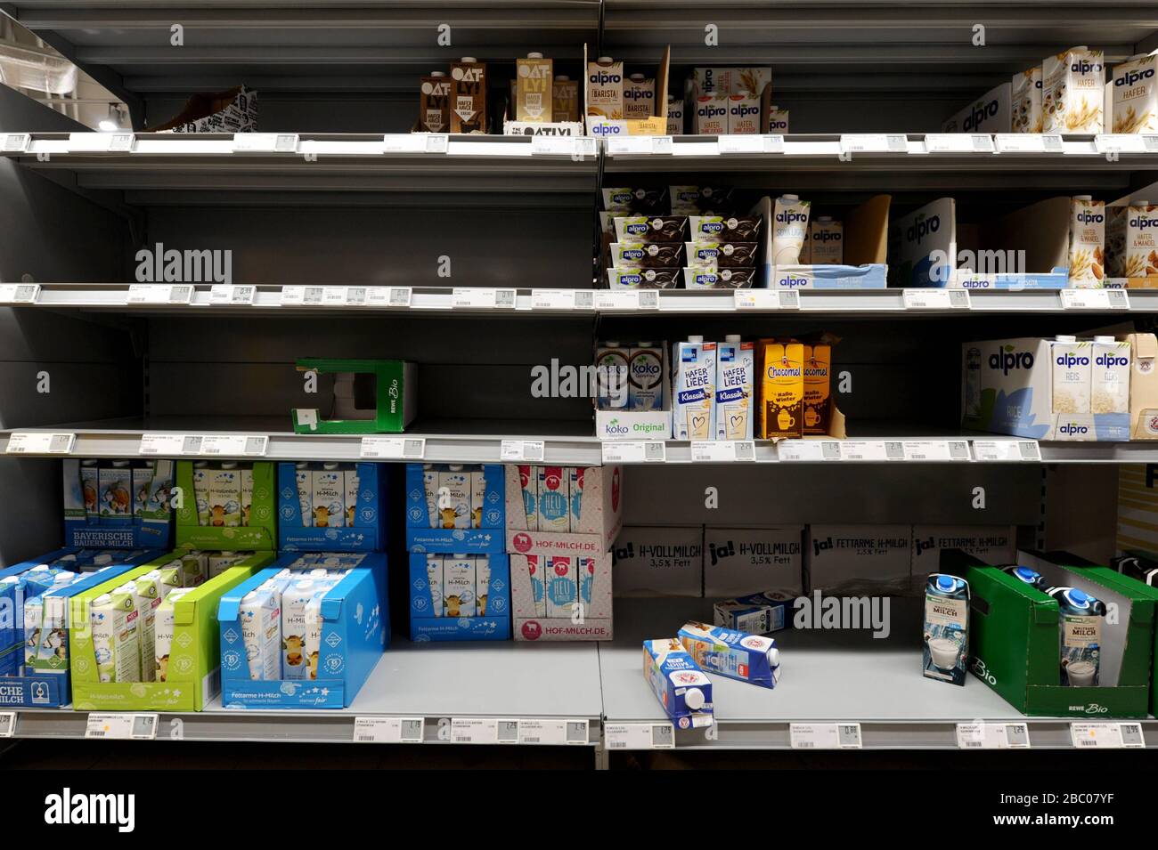 Food shopping in times of the Corona pandemic: in the picture empty shelves of toilet paper, pasta and dairy products in a branch of the supermarket chain Rewe in Obergiesing. [automated translation] Stock Photo