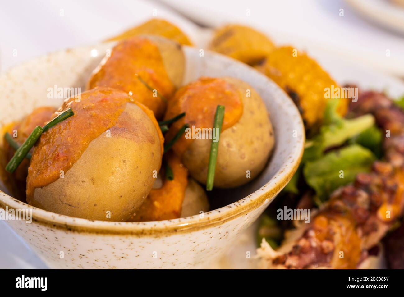 Spain, Canary Islands, Gran Canaria - local food. Here in this pic “papas arrugadas with mojo”, a canary hot sauce Stock Photo