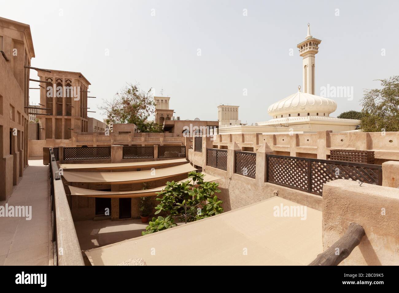 Old town courtyard in Dubai with Diwan mosque in the backround Stock