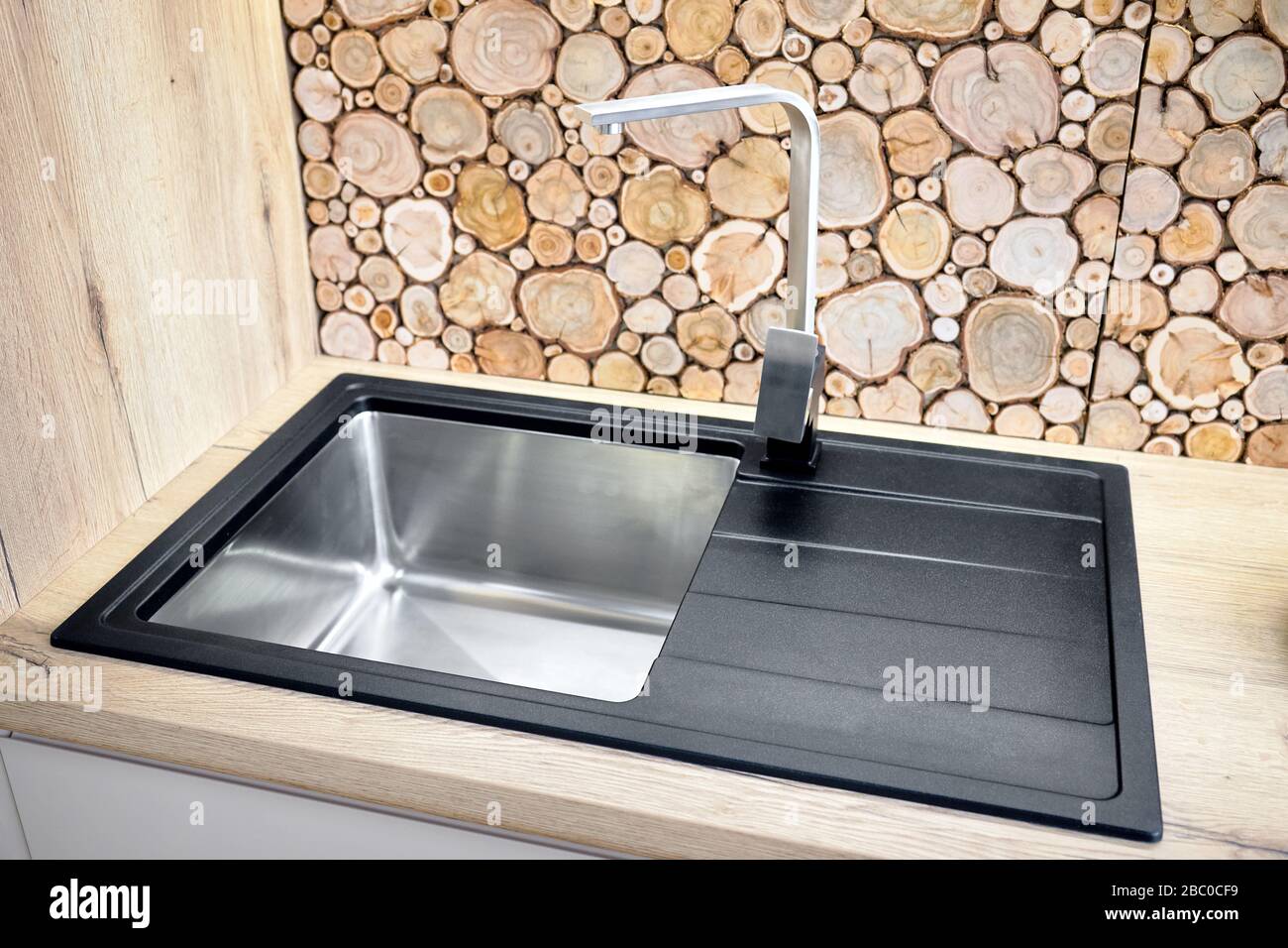 Modern design chrome water tap over stainless steel kitchen sink ...