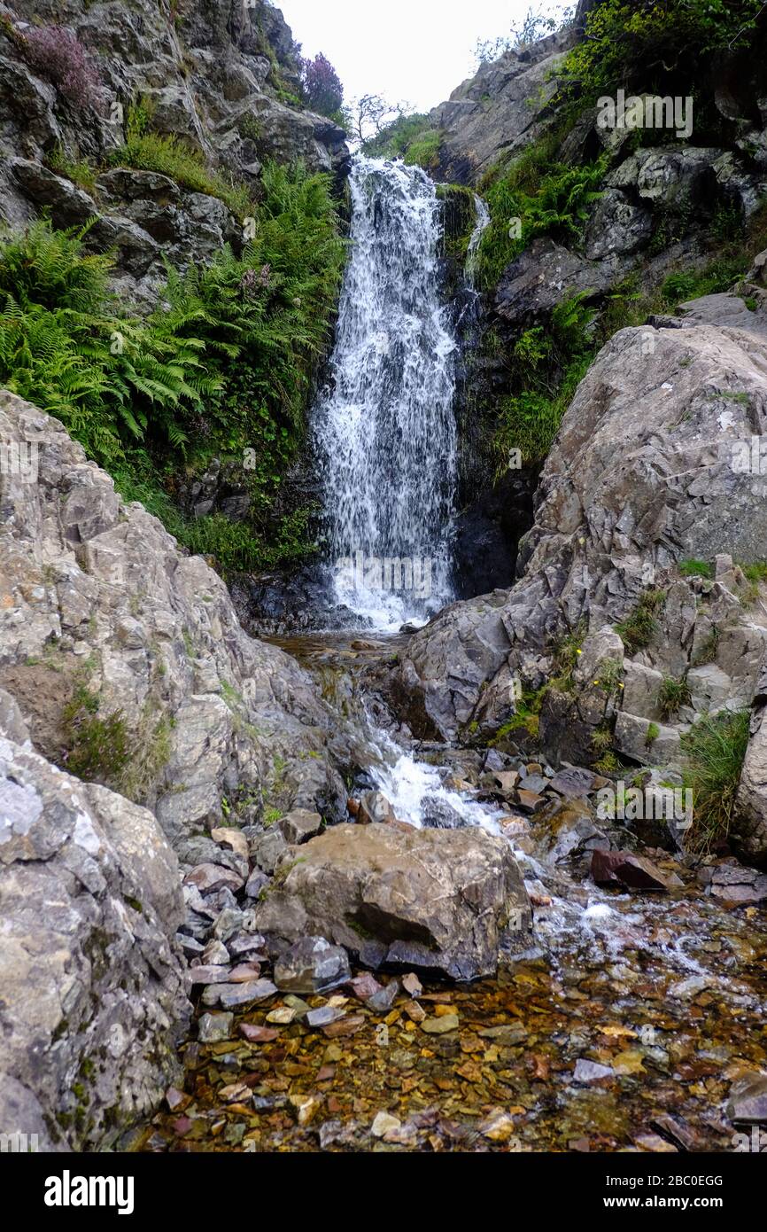 The lightspout waterfall at the summit of Carding Mill Valley on the outskirts of the Long Mynd range and the town of Church Stretton in Shropshire. Stock Photo