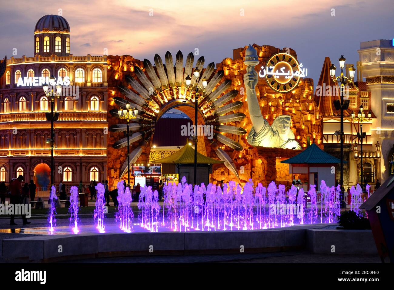 Night time shot of the Americas section inside Global Village, Dubai, UAE. Global Village combines cultures of 90 countries across the world. Stock Photo