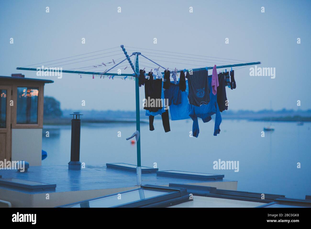 washing hanging to dry on an old houseboat Stock Photo